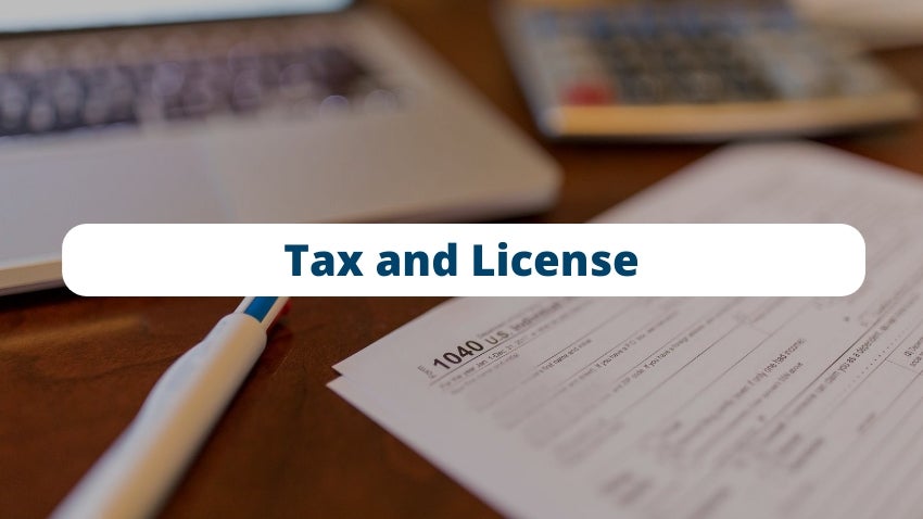 Tax & License: Stack of tax forms and calculator