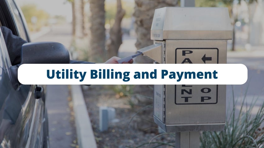Utility Billing and Payment: Person dropping payment in utility payment dropbox