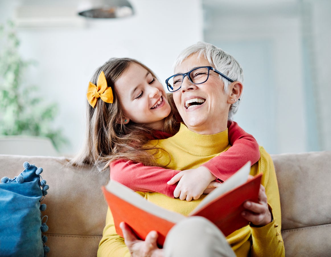 Grandmother and granddaughter reading