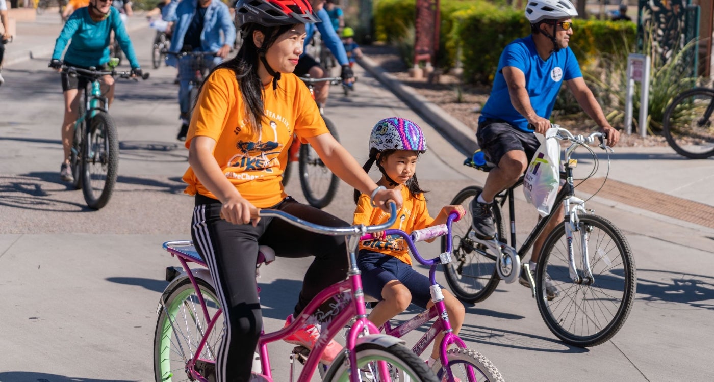 Family riding bikes at the Chandler Family Bike Ride