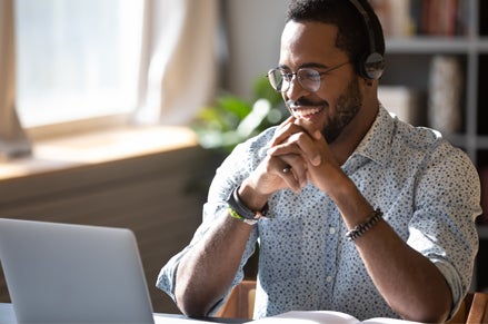 Man on a computer at home
