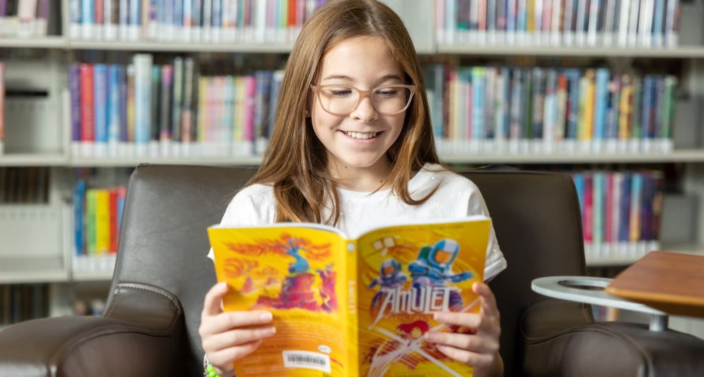 Teen Girl Reading a Book