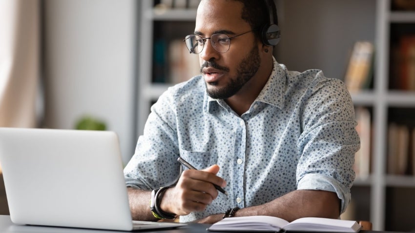 man working from home on laptop man working from home on laptop