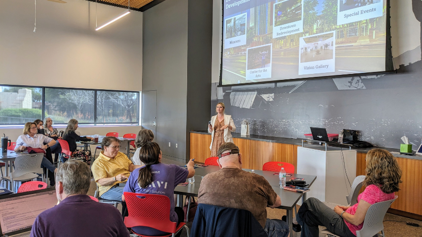 Lauren Koll with Downtown Redevelopment presents to Good Neighbor 101 program attendees