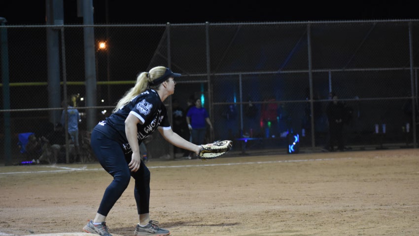 adult women catching a softball