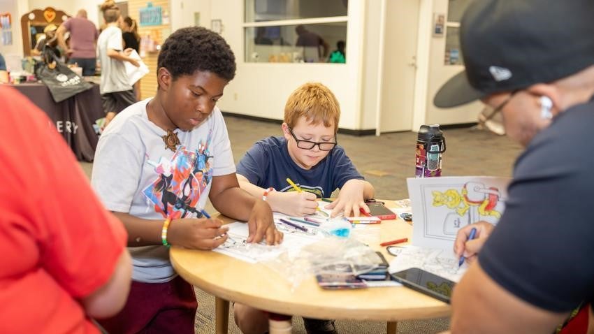 boys doing arts at Chandler library Contigo