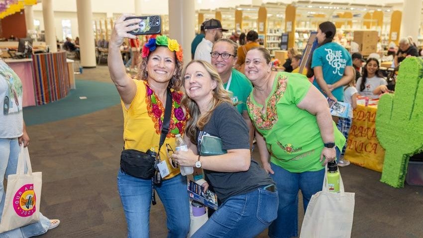 women smiling at Chandler library Contigo