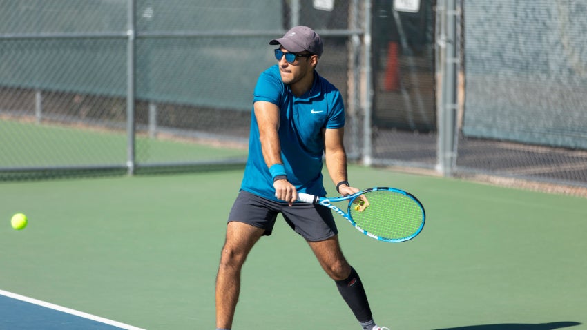 hitting a tennis ball 