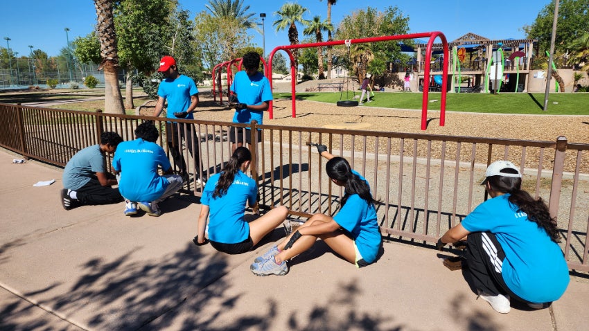 LIT Participant Teen LIT working on park fence