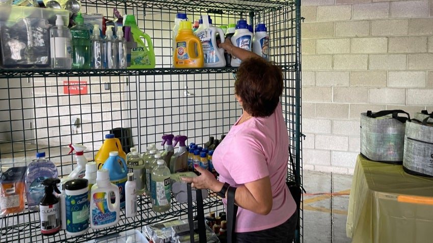 senior woman restock household items