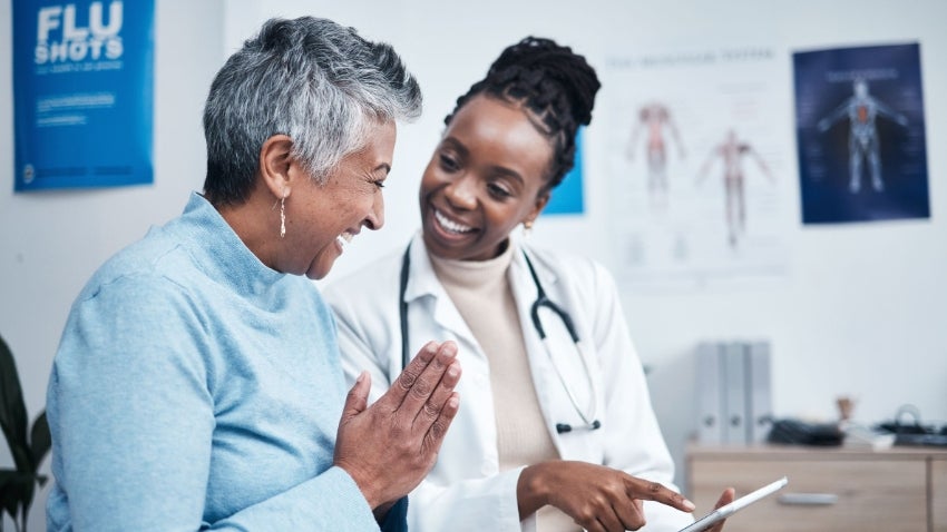 senior woman talking to a doctor
