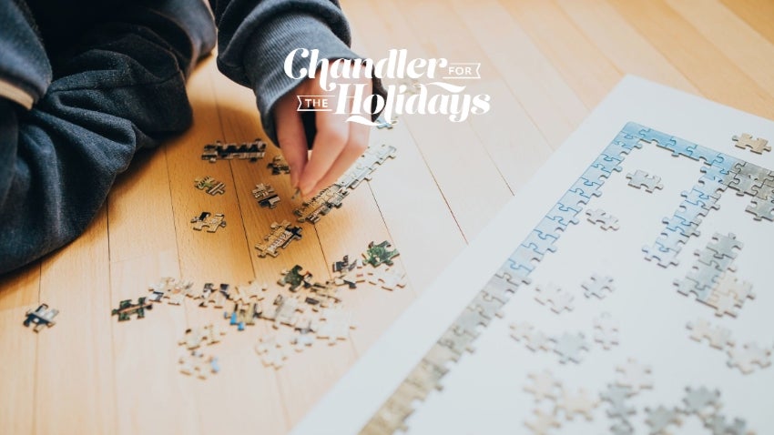 close up of someone putting together a puzzle