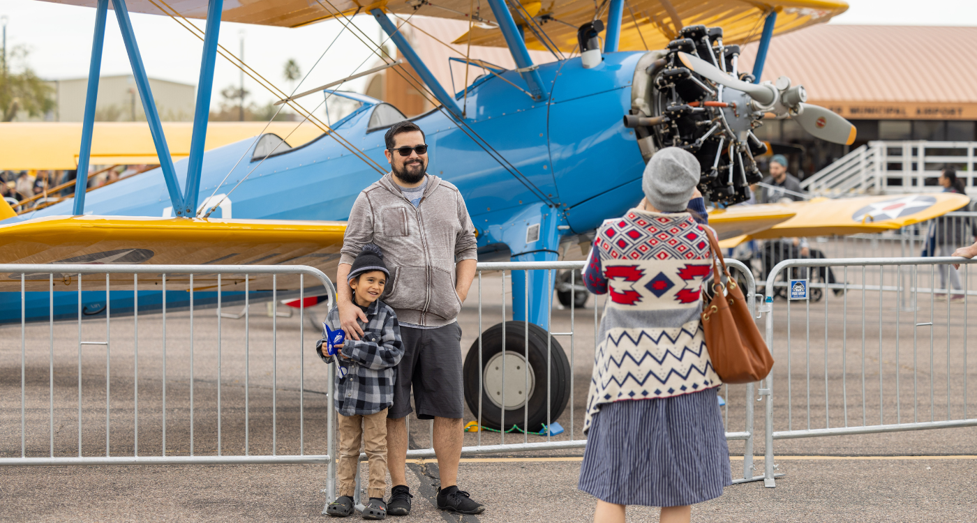 Guests admiring an older model plane