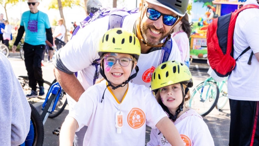 Family Bike Ride: Dad and two kids at the Family Bike Ride