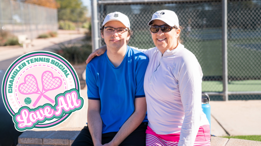 mom and son sitting at the tennis center