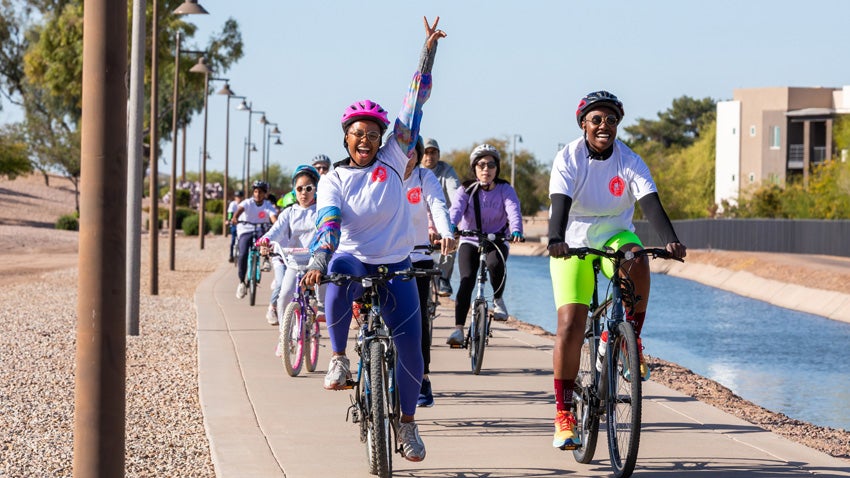 Several cyclists traveling along the canal during the 2025 Family Bike Ride