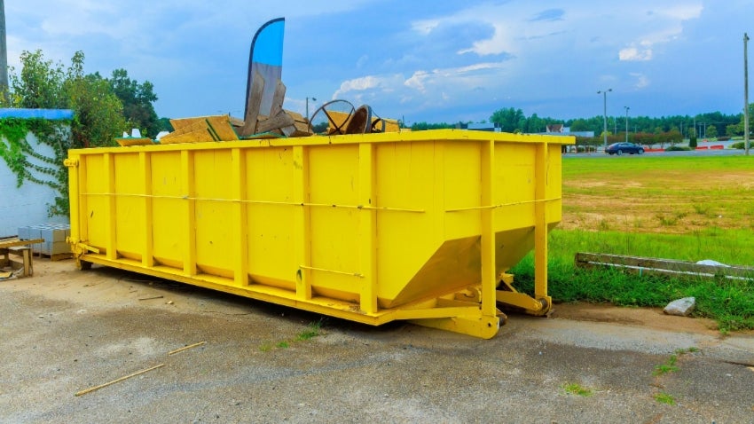 Yellow commerical dumpster