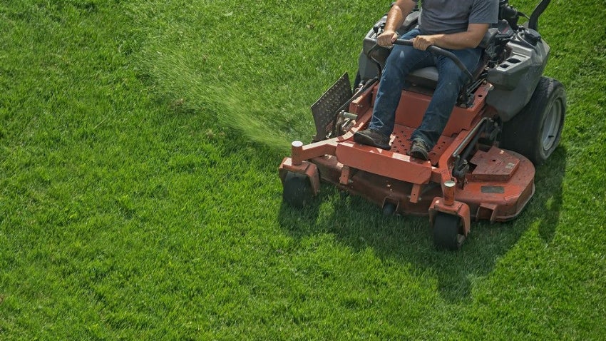 Landscape Contractor mowing lawn