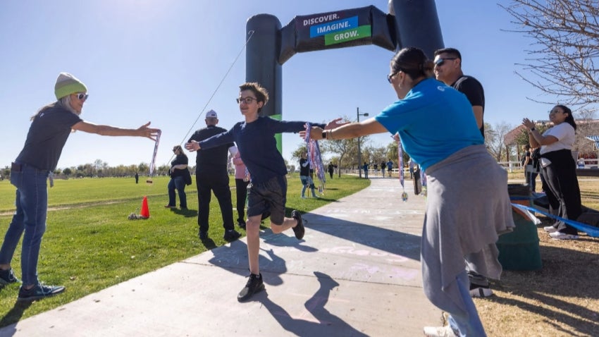 Fun run participant at the finish line