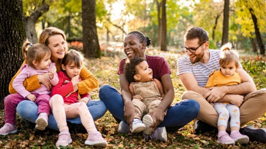 Moms and Toddlers Sitting in the forest