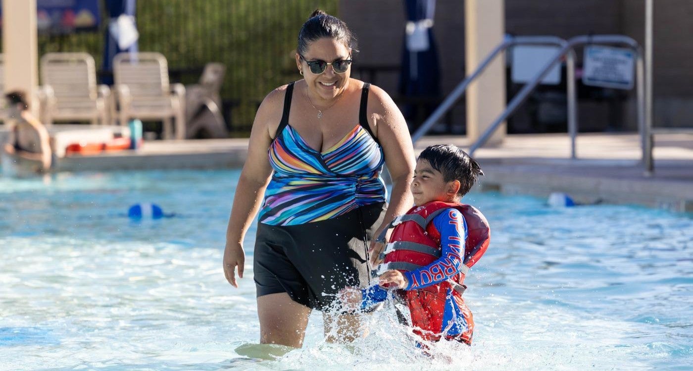 mom playing with son at a Chandler pool