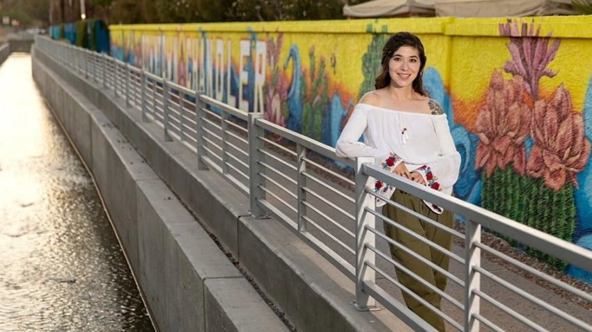 Artist in front on Downtown Chandler Mural