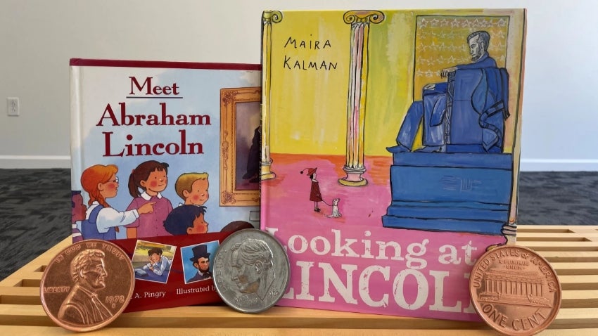 Collection featuring two children's books about Abraham Lincoln, 2 pennies and a dime