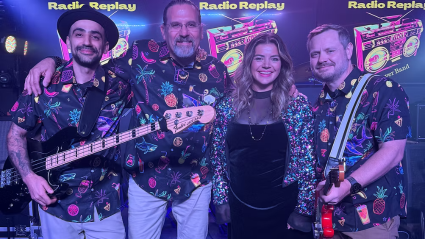 band members of Radio Replay standing together and smilling