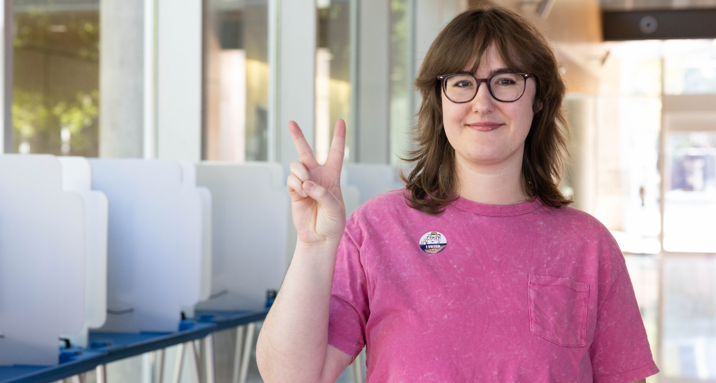 Voter holding up the peace sign