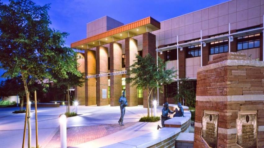 Chandler Police Headquarter building at night with lights illuminating the entrance