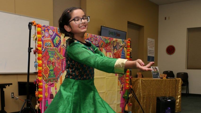 girl dancing at diwali