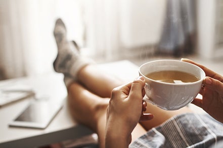 A man holding a cup of tea