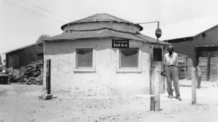 N.J. Harris standing outside his BBQ restaurant in 1952, Chandler Museum Collection, 1986.74.9