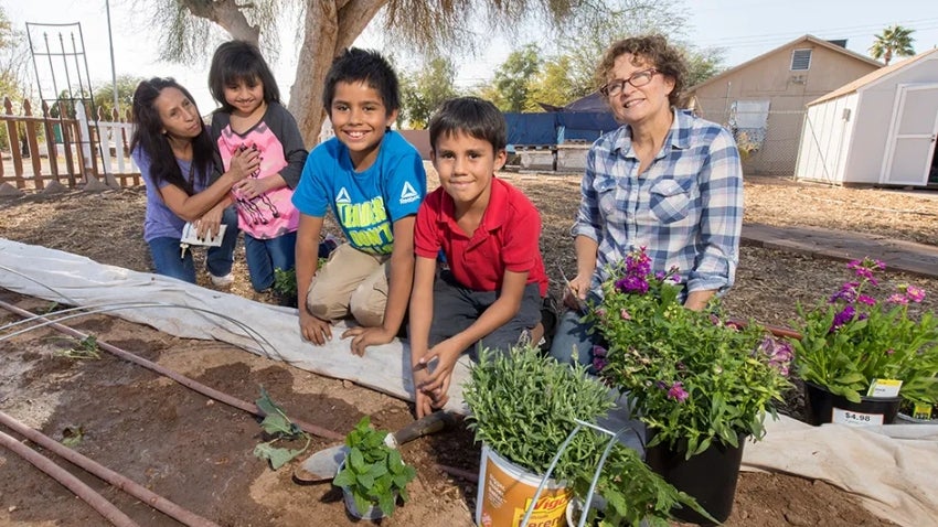 Kids helping in the community garden