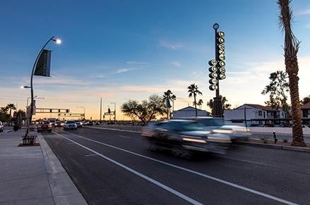 Car driving down city street