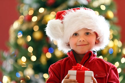 Child receives a gift during the holidays