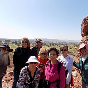 Active adult group enjoying a hike at a nearby mountain preserve 
