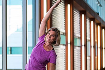 Active adult women practicing yoga