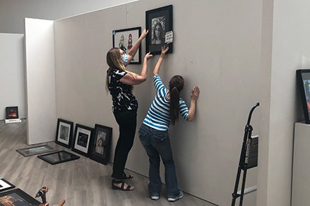 CUSD teachers help set up Gallery space before the show image-placeholder