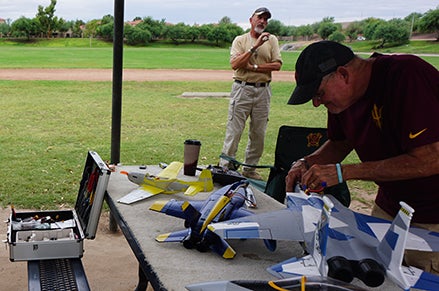 Flyers work on RC planes and share stories