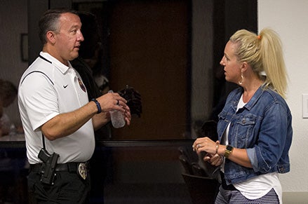 Chandler Police Officer/Guardian Academy instructor talking with class participant