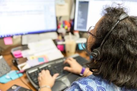 solid waste customer service rep at desk
