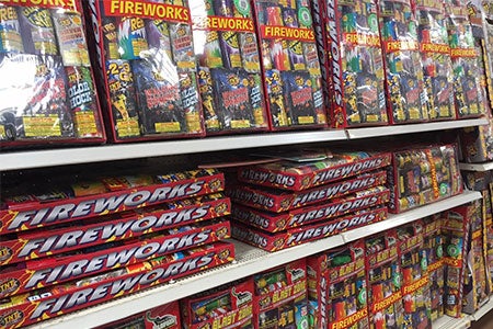 Shelf display of sparklers and novelty fireworks for sale. Shelf display of sparklers and novelty fireworks for sale.