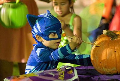 Boy in Batman costume at Halloween Spooktacular