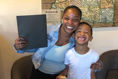 Chandler female resident and child smiling