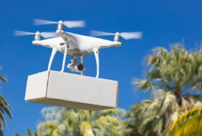 Drone carrying package for delivery