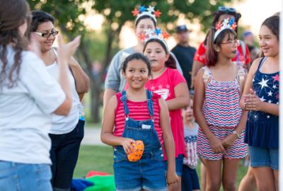 Photo of a family playing yard games at Chandler's All-American Bash
