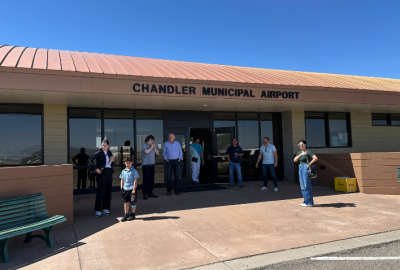 Residents waiting for the tour bus to take them around the airfield during an airport tour