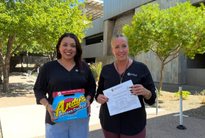 Neighborhood Programs team: Priscilla Quintana and Tawna Mower holding Andy's Custard and neighborhood handout