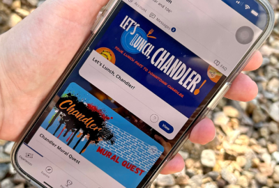 Cell phone with two Choose Chandler experiences on display